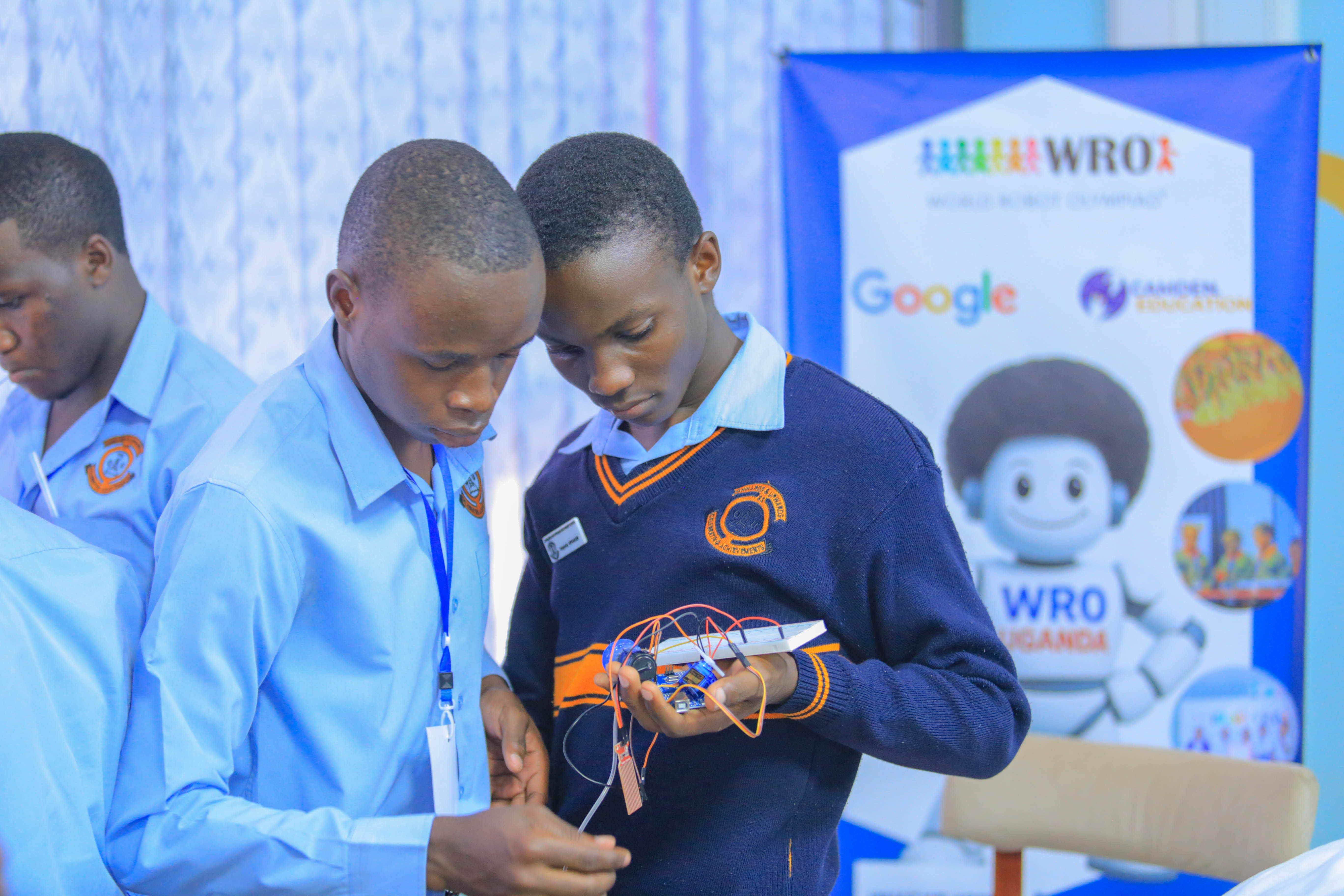 Students engaged with WRO robotics equipment